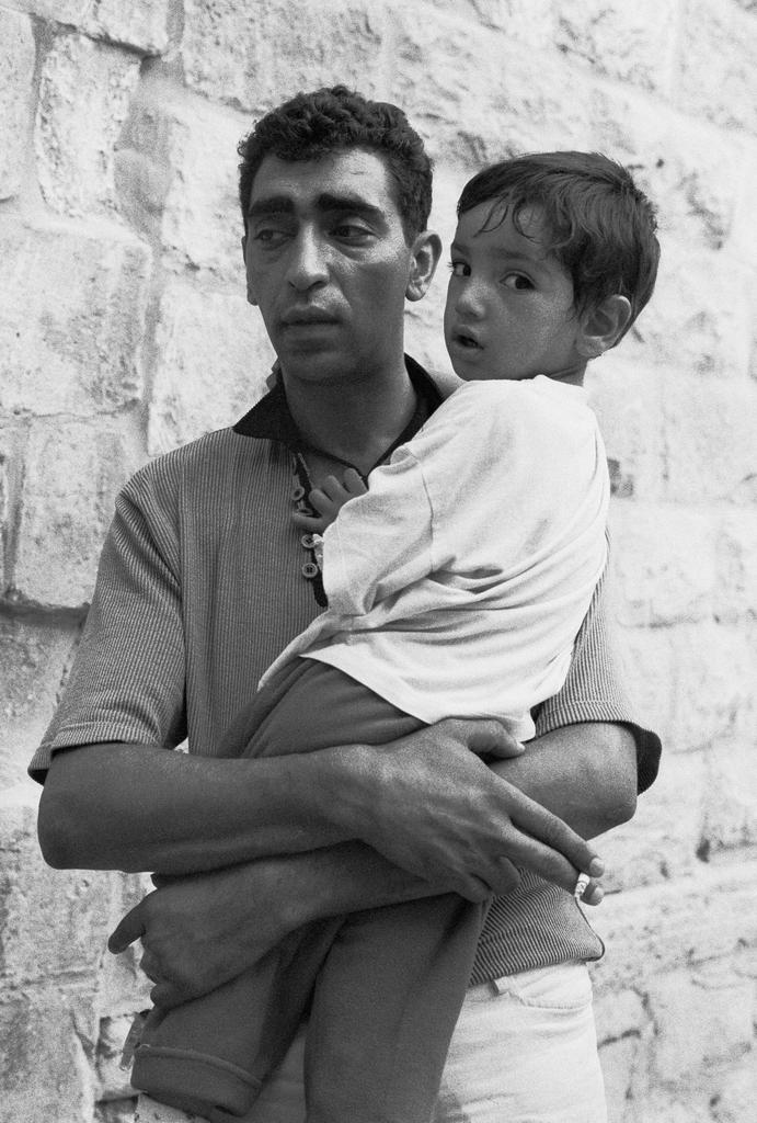 Man with a mutilated child