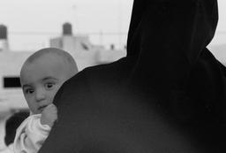 Mother and child at a street performance